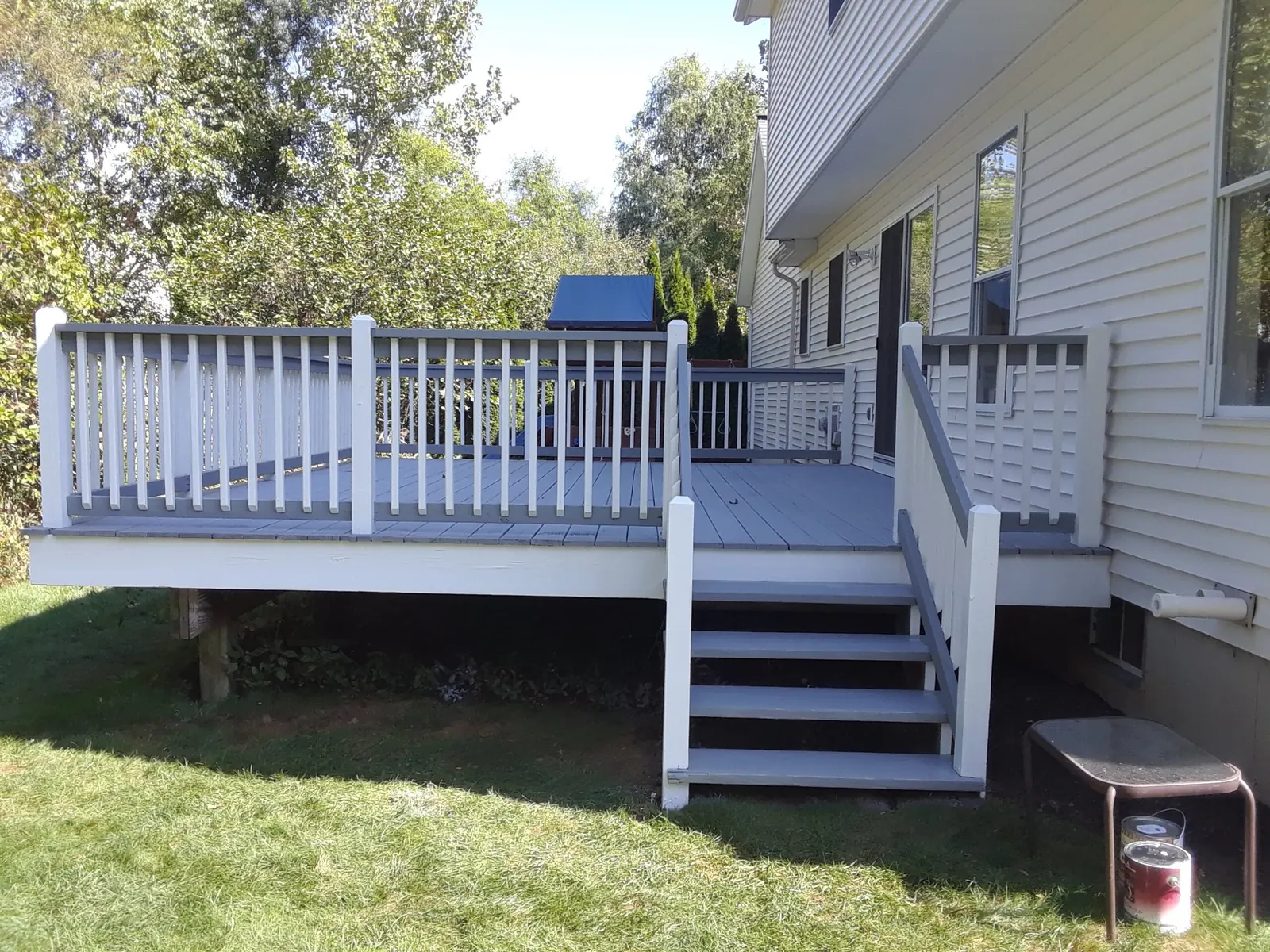Deck with white rails and gray floor by Old Coach Pro Painting